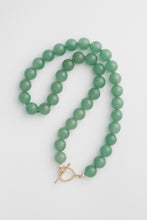 Load image into Gallery viewer, Green beaded necklace with a gold clasp on a light gray background