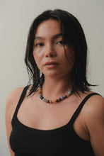 Load image into Gallery viewer, Woman wearing a black tank top and colorful beaded necklace against a plain background
