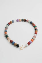 Load image into Gallery viewer, Multicoloured beaded necklace with a gold clasp on a light grey background
