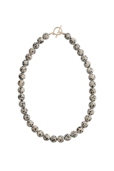 Necklace with beige and black beads and a gold clasp on a white background