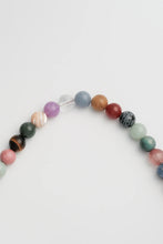 Load image into Gallery viewer, Multicoloured beaded necklace on a light grey background

