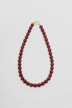 Load image into Gallery viewer, Red beaded necklace on a white background
