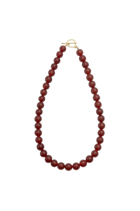 Red beaded necklace on a white background