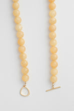 Load image into Gallery viewer, Two yellow beaded necklaces with gold clasp on a light grey background
